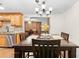 Bright dining room with wood table and chandelier at 5621 Moog Rd, New Port Richey, FL 34652