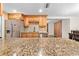 Modern kitchen with granite countertops and stainless steel appliances at 5621 Moog Rd, New Port Richey, FL 34652