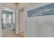Hallway with beach-themed wall art and light walls at 707 Winterside Dr, Apollo Beach, FL 33572