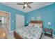 Peaceful bedroom with a queen bed, light blue walls and ceiling fan at 707 Winterside Dr, Apollo Beach, FL 33572