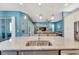 Kitchen island with granite countertop, double sink, and breakfast bar at 707 Winterside Dr, Apollo Beach, FL 33572