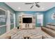 Living room with large TV and comfortable seating at 707 Winterside Dr, Apollo Beach, FL 33572