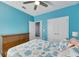 Bright bedroom with a queen bed and double door closet at 707 Winterside Dr, Apollo Beach, FL 33572