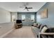 Relaxing loft area featuring a gray couch and ceiling fan at 707 Winterside Dr, Apollo Beach, FL 33572