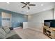 Comfortable loft area with a couch and flat-screen TV at 707 Winterside Dr, Apollo Beach, FL 33572