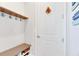 Convenient laundry area with bench and hooks at 707 Winterside Dr, Apollo Beach, FL 33572