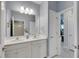 Double vanity bathroom with a view of a bedroom at 707 Winterside Dr, Apollo Beach, FL 33572