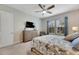 Bright bedroom with a king-size bed, dresser, and plenty of natural light at 707 Winterside Dr, Apollo Beach, FL 33572