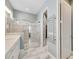 Large bathroom with a walk-in shower and heated towel rack at 707 Winterside Dr, Apollo Beach, FL 33572