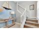 Stylish staircase with white railing and wood-look flooring at 707 Winterside Dr, Apollo Beach, FL 33572