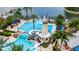 Community pool with lighthouse water feature and surrounding lounge chairs at 707 Winterside Dr, Apollo Beach, FL 33572