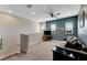 Bright loft bedroom with a ceiling fan and comfy couch at 707 Winterside Dr, Apollo Beach, FL 33572