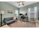 Home office with a desk, comfortable sofa, and ceiling fan at 707 Winterside Dr, Apollo Beach, FL 33572