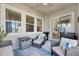 Relaxing covered patio with comfortable seating and grill at 707 Winterside Dr, Apollo Beach, FL 33572
