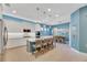 Modern kitchen with island, stainless steel appliances, and blue accents at 707 Winterside Dr, Apollo Beach, FL 33572