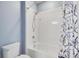 Clean bathroom with a shower/tub combo and white tile at 707 Winterside Dr, Apollo Beach, FL 33572