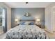 Main bedroom with ensuite bathroom view and ceiling fan at 707 Winterside Dr, Apollo Beach, FL 33572