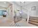 Elegant entryway with staircase, console table, and stylish decor at 707 Winterside Dr, Apollo Beach, FL 33572