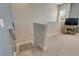 Spacious loft area with plush carpeting and a TV at 707 Winterside Dr, Apollo Beach, FL 33572