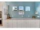 White cabinets and granite countertops with decorative wall accents at 707 Winterside Dr, Apollo Beach, FL 33572