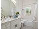 Modern bathroom with a tub, shower and updated vanity at 10213 Golden Eagle Dr, Largo, FL 33778