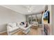Spacious living room with sectional sofa, hardwood floors and fireplace at 2717 Via Cipriani # 622B, Clearwater, FL 33764