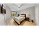 Main bedroom with a double bed and a wood dresser at 2717 Via Cipriani # 622B, Clearwater, FL 33764