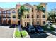 Luxury condo building with palm trees and ample parking at 2717 Via Cipriani # 622B, Clearwater, FL 33764