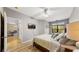 Main bedroom with a large bed, and access to the dining area at 2717 Via Cipriani # 622B, Clearwater, FL 33764