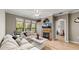 Spacious living room featuring a fireplace and large windows at 2717 Via Cipriani # 622B, Clearwater, FL 33764