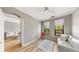 Small bedroom with light walls, hardwood floors and a sofa at 2717 Via Cipriani # 622B, Clearwater, FL 33764