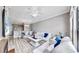 Bright living room with comfy sofas, a coffee table, and hardwood floors at 2717 Via Cipriani # 622B, Clearwater, FL 33764