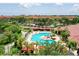 Community pool with lounge chairs and covered seating areas at 2717 Via Cipriani # 622B, Clearwater, FL 33764