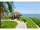 Relaxing waterfront gazebo with seating and grilling area at 2717 Via Cipriani # 622B, Clearwater, FL 33764