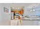 Updated kitchen featuring granite countertops and wood cabinets at 2717 Via Cipriani # 622B, Clearwater, FL 33764