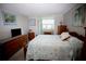 Bedroom with a queen-size bed and wood dresser at 1901 Oyster Catcher Ln # 814, Clearwater, FL 33762