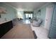Living room with comfortable seating and access to a patio at 1901 Oyster Catcher Ln # 814, Clearwater, FL 33762