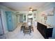 Condo dining area with wooden table and seating for four at 1901 Oyster Catcher Ln # 814, Clearwater, FL 33762