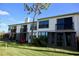 Two-story building exterior with multiple units and balconies at 1901 Oyster Catcher Ln # 814, Clearwater, FL 33762