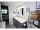 Clean bathroom with grey vanity and access to bedroom at 1901 Oyster Catcher Ln # 814, Clearwater, FL 33762