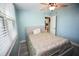Light blue bedroom with a queen bed and access to the kitchen at 1901 Oyster Catcher Ln # 814, Clearwater, FL 33762