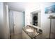 Bathroom with granite countertop, stacked washer, and dryer at 1901 Oyster Catcher Ln # 814, Clearwater, FL 33762