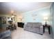 Living room with gray sofa, decorative art, and light walls at 1901 Oyster Catcher Ln # 814, Clearwater, FL 33762