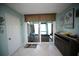 Bright dining area with sliding glass doors leading to patio at 1901 Oyster Catcher Ln # 814, Clearwater, FL 33762
