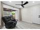 Relaxing living room with a recliner chair and a sliding glass door to the outside at 1802 E Hamilton Ave, Tampa, FL 33610