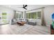 This bright living room features a large sectional sofa and a big window at 1802 E Hamilton Ave, Tampa, FL 33610