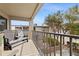 Relaxing balcony with patio furniture and partial view of the neighborhood at 19725 Gulf Blvd # 20, Indian Shores, FL 33785
