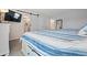 Main bedroom with a large bed and en-suite bathroom at 19725 Gulf Blvd # 20, Indian Shores, FL 33785