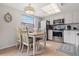 Bright kitchen with stainless steel appliances and white cabinets at 19725 Gulf Blvd # 20, Indian Shores, FL 33785