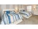 Two twin beds with white frame in a spacious bedroom at 19725 Gulf Blvd # 20, Indian Shores, FL 33785